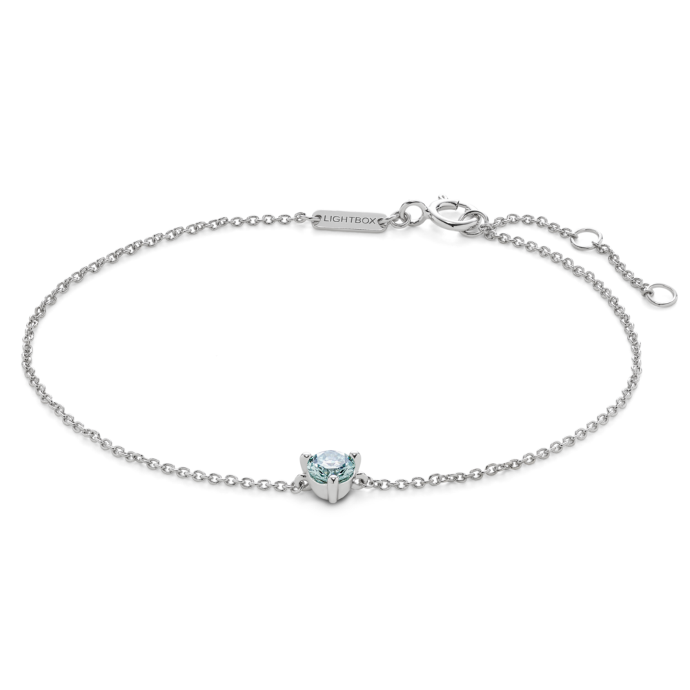 Front view of blue 0.25 carat round brilliant solitaire bracelet in 14k white gold